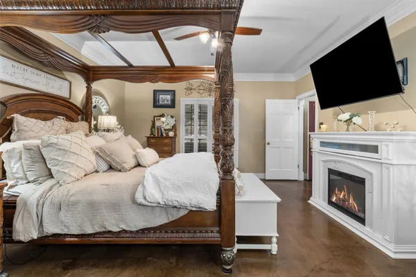 a bedroom with bed and wooden floor