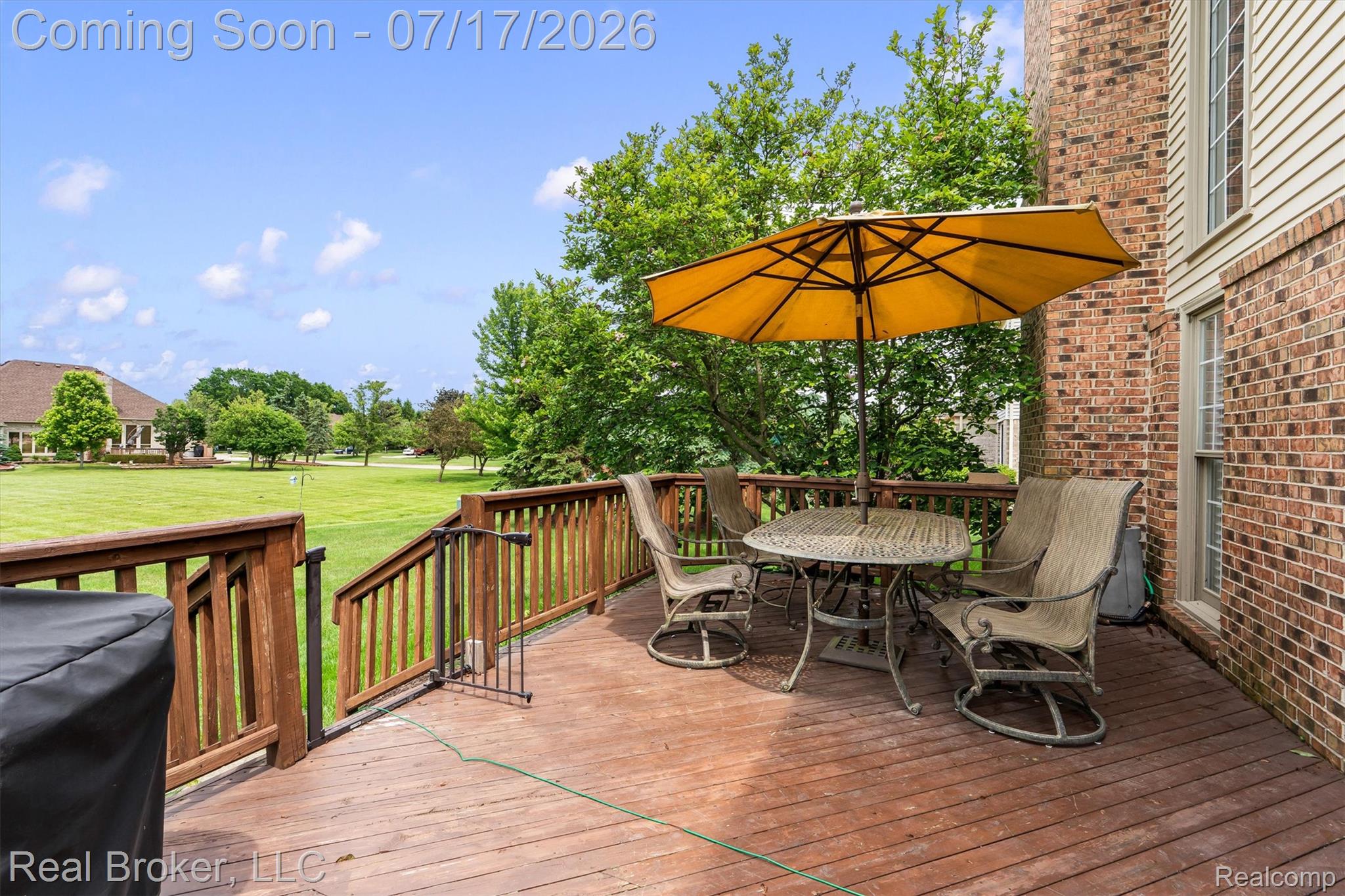 45192 Thornhill Road Canton, MI 48188 - Photo 32 of 34 Spacious outdoor wood deck with perimeter railing and a brick-faced exterior
