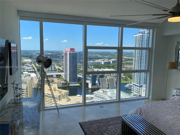 a living room with large windows