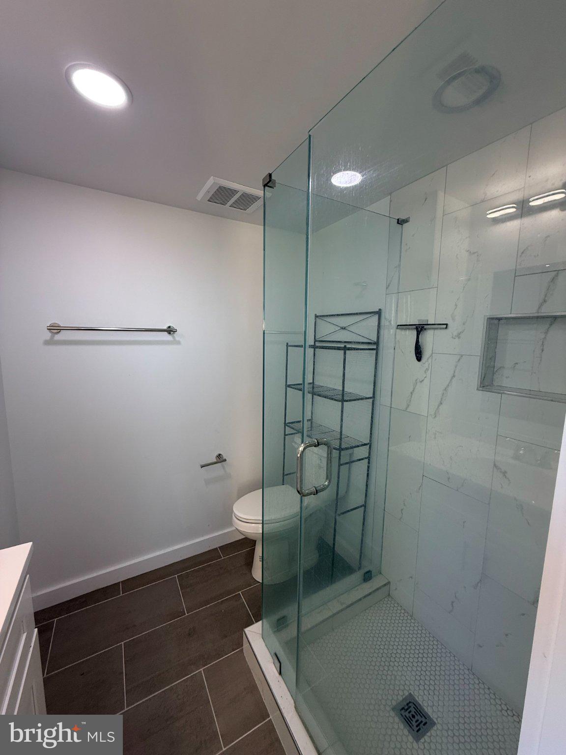 3601 14th Street Northwest, Unit 9 Washington, DC 20010 - Photo 19 of 34 Sleek modern bathroom with glass shower.