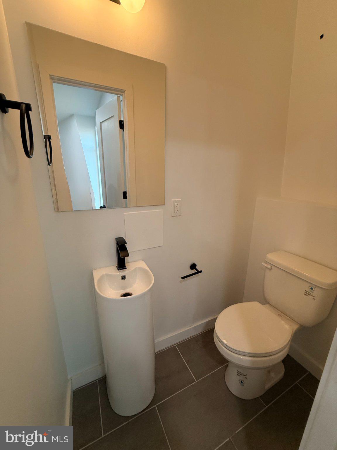 3601 14th Street Northwest, Unit 9 Washington, DC 20010 - Photo 7 of 34 Sleek and modern half-bath retreat.