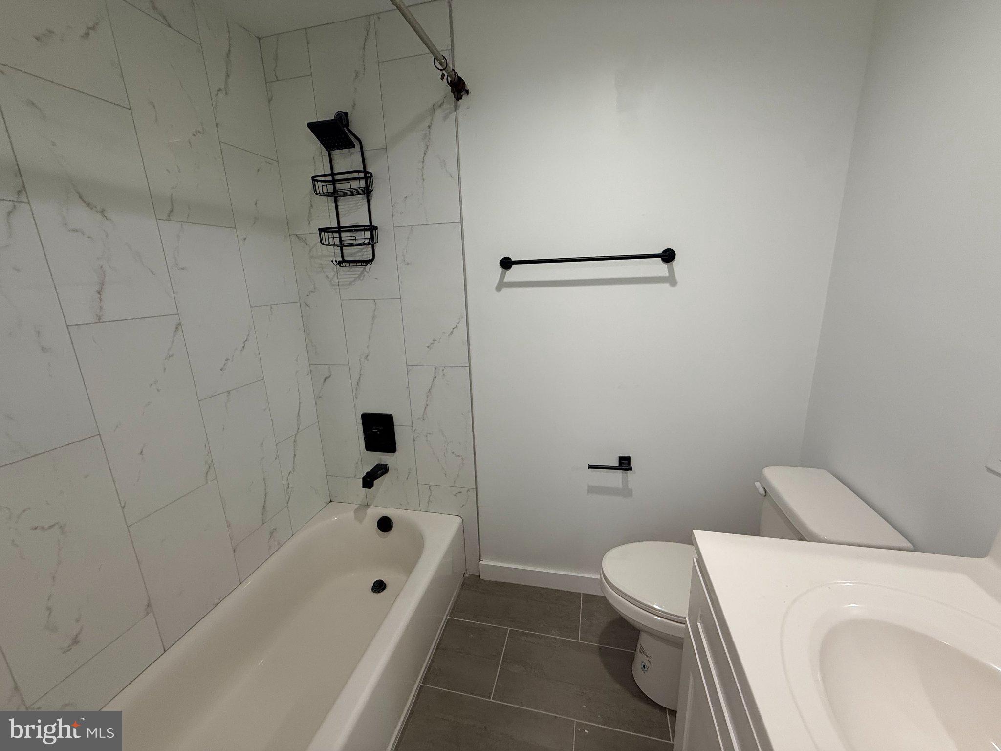 3601 14th Street Northwest, Unit 9 Washington, DC 20010 - Photo 8 of 34 Sleek modern bathroom with elegant tiles.