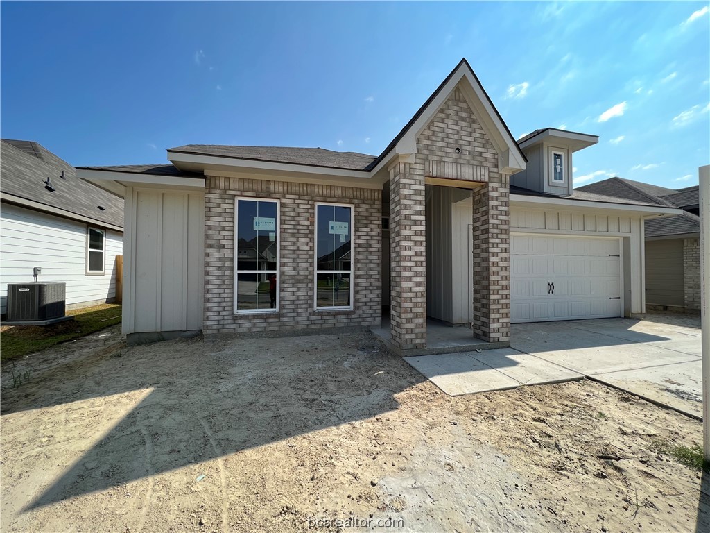 a view of a house with wooden fence