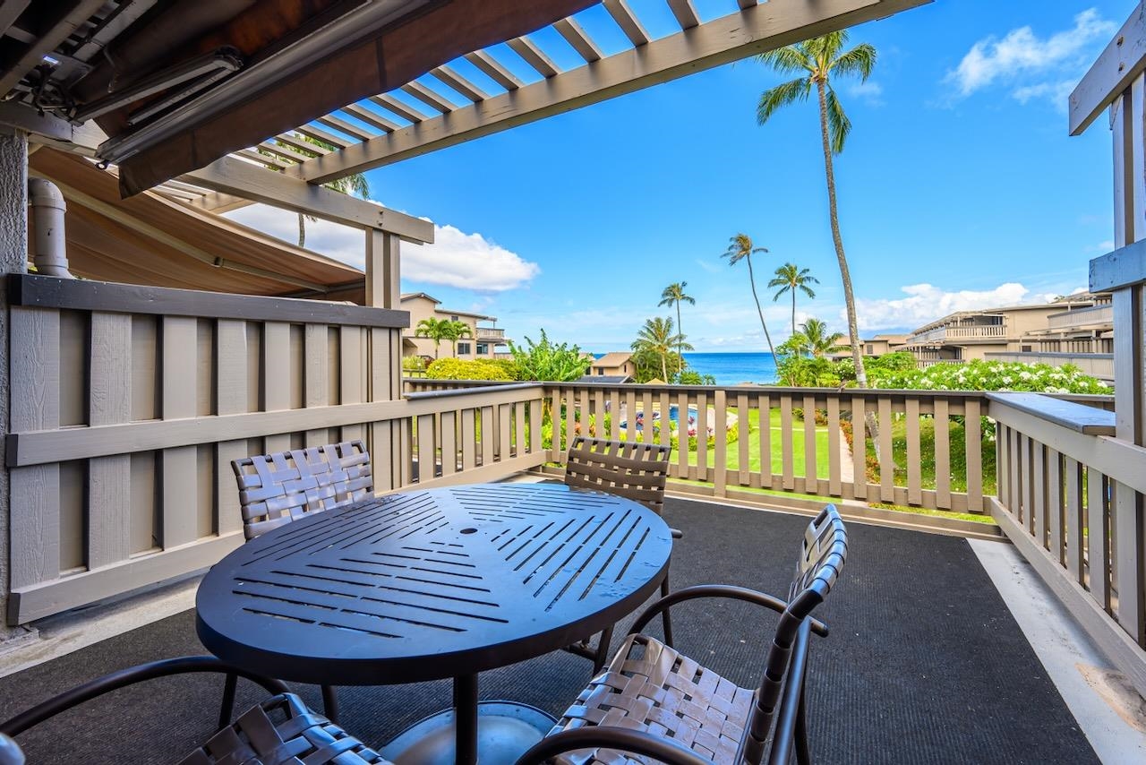4909 Lower Honoapiilani Road, Unit D6 Lahaina, HI 96761 - Photo 11 of 47 a view of a balcony dining area