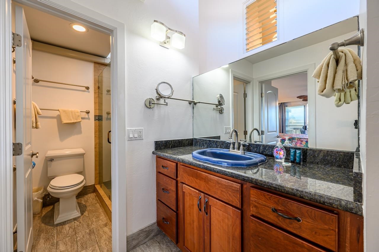 4909 Lower Honoapiilani Road, Unit D6 Lahaina, HI 96761 - Photo 20 of 47 a bathroom with a granite countertop sink toilet and shower