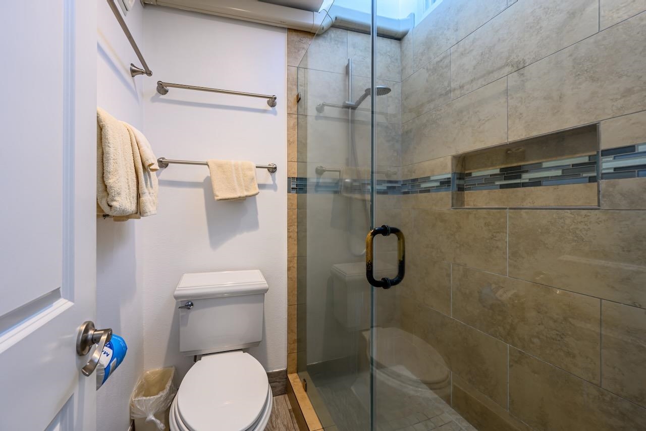 4909 Lower Honoapiilani Road, Unit D6 Lahaina, HI 96761 - Photo 21 of 47 a bathroom with a toilet and a shower