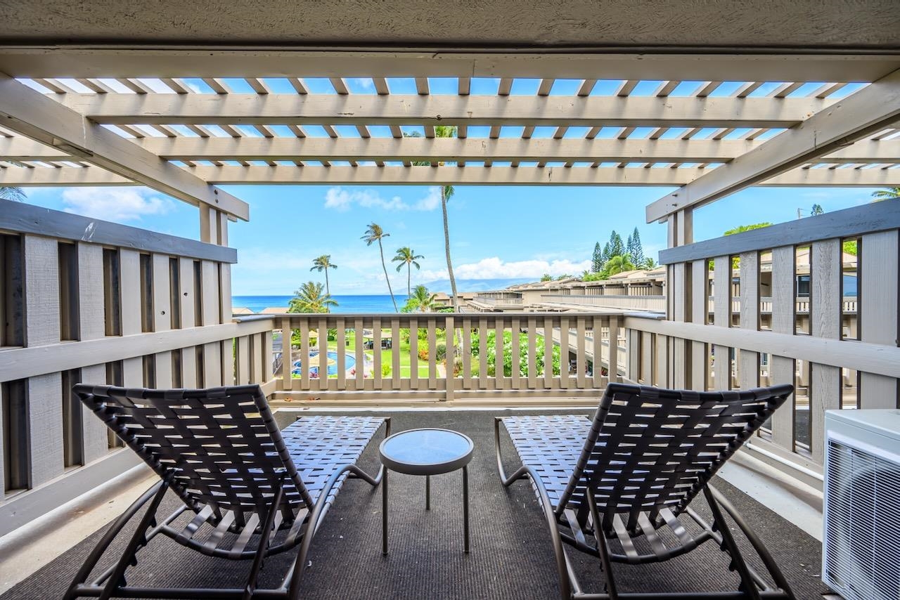 4909 Lower Honoapiilani Road, Unit D6 Lahaina, HI 96761 - Photo 27 of 47 a view of a chairs and table in the balcony