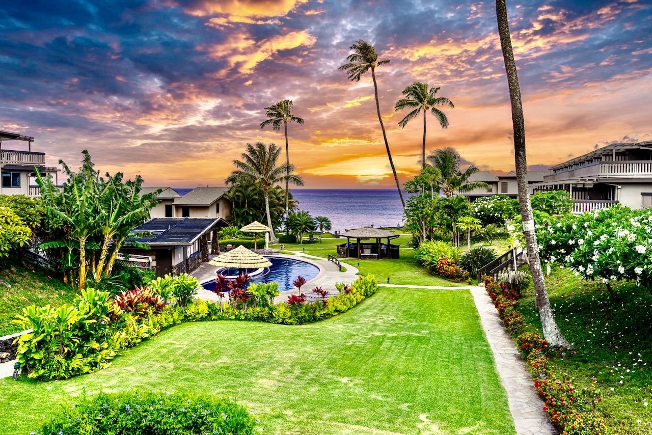 4909 Lower Honoapiilani Road, Unit D6 Lahaina, HI 96761 - Photo 29 of 47 a front view of a multi story residential apartment building with yard
