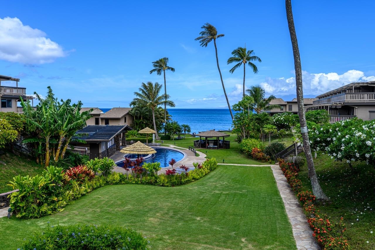 4909 Lower Honoapiilani Road, Unit D6 Lahaina, HI 96761 - Photo 33 of 47 a view of a yard with a slide