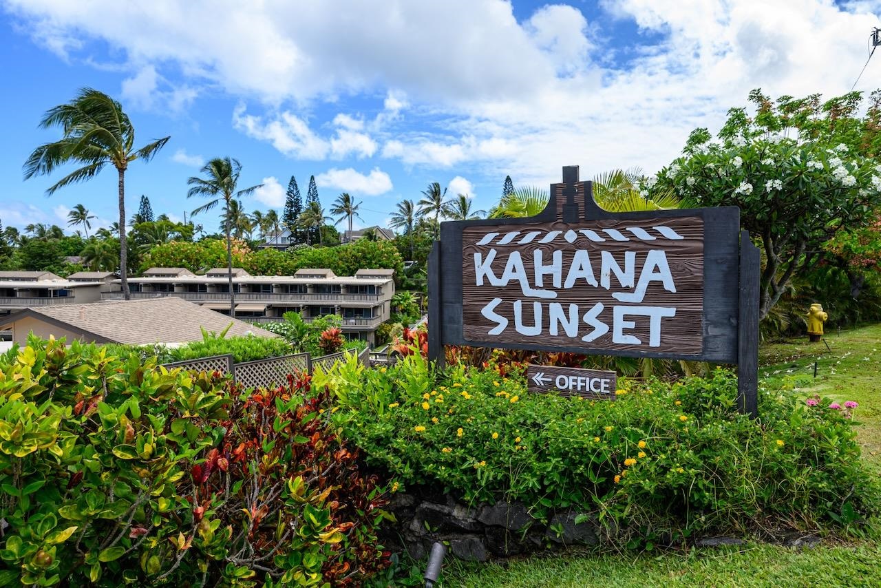 4909 Lower Honoapiilani Road, Unit D6 Lahaina, HI 96761 - Photo 35 of 47 a view of a sign board with flower garden