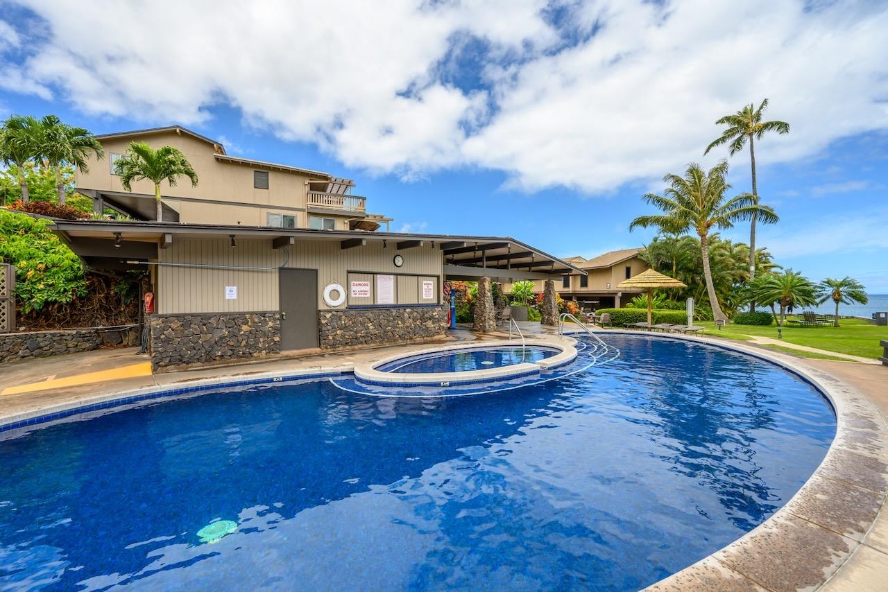 4909 Lower Honoapiilani Road, Unit D6 Lahaina, HI 96761 - Photo 46 of 47 a view of a swimming pool with a yard