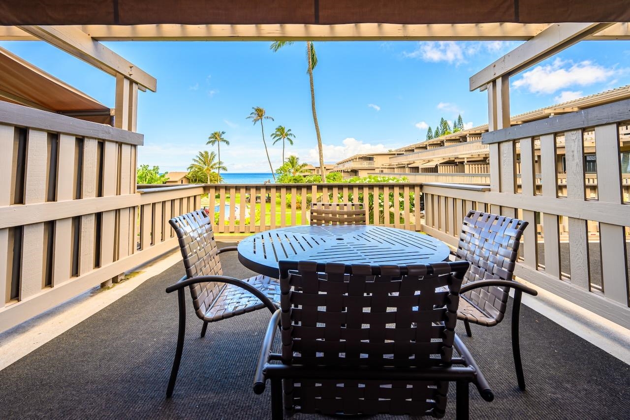 4909 Lower Honoapiilani Road, Unit D6 Lahaina, HI 96761 - Photo 10 of 47 a view of a chairs and table in the balcony