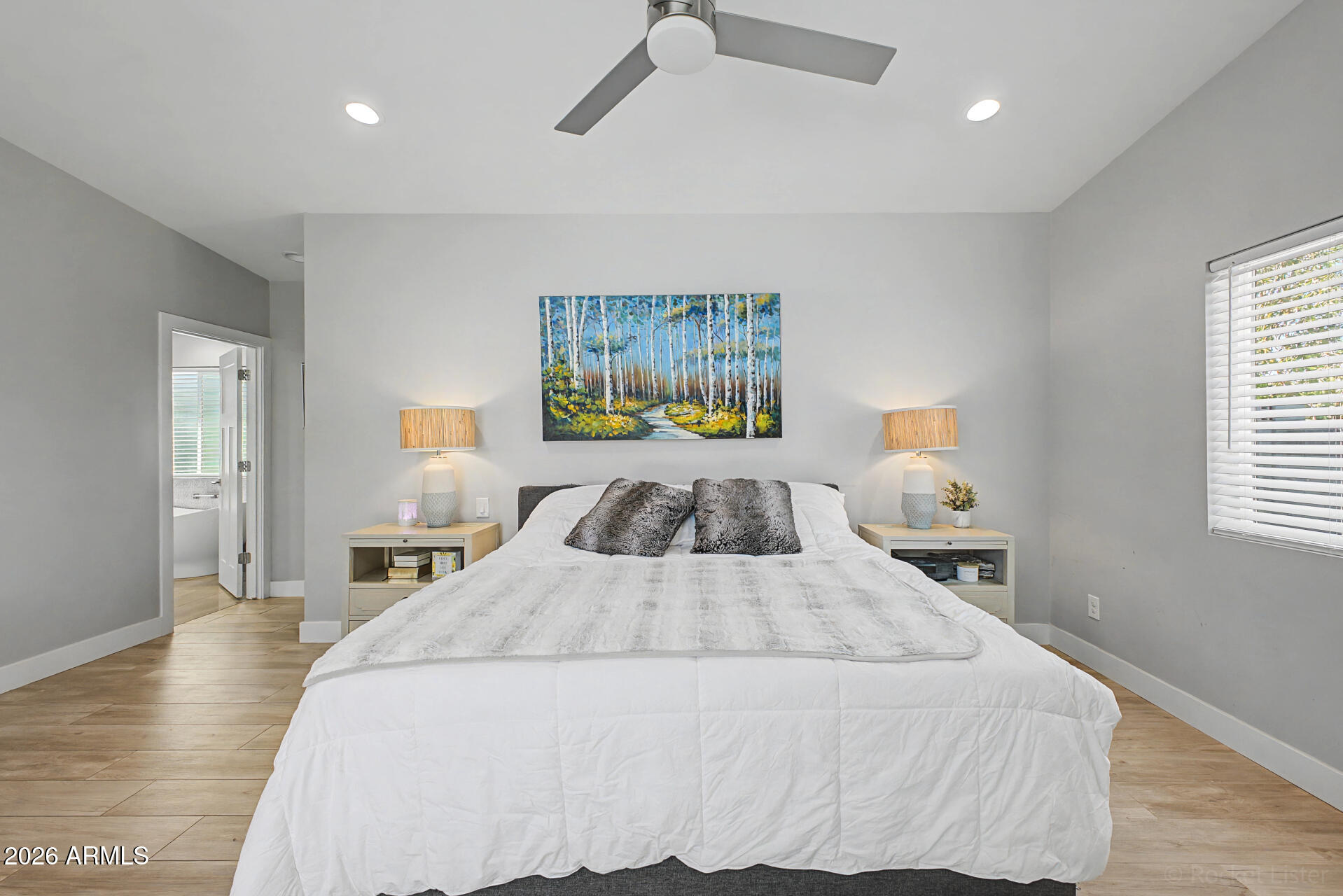 1930 East Rovey Avenue Phoenix, AZ 85016 - Photo 12 of 29 a bedroom with a bed and a painting on the wall