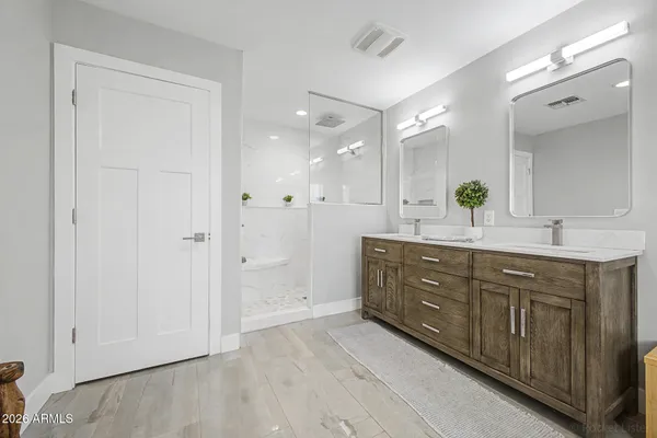 a spacious bathroom with a bathtub and sink