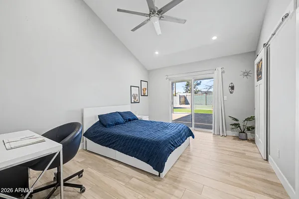 a bathroom with a double vanity sink toilet and a mirror