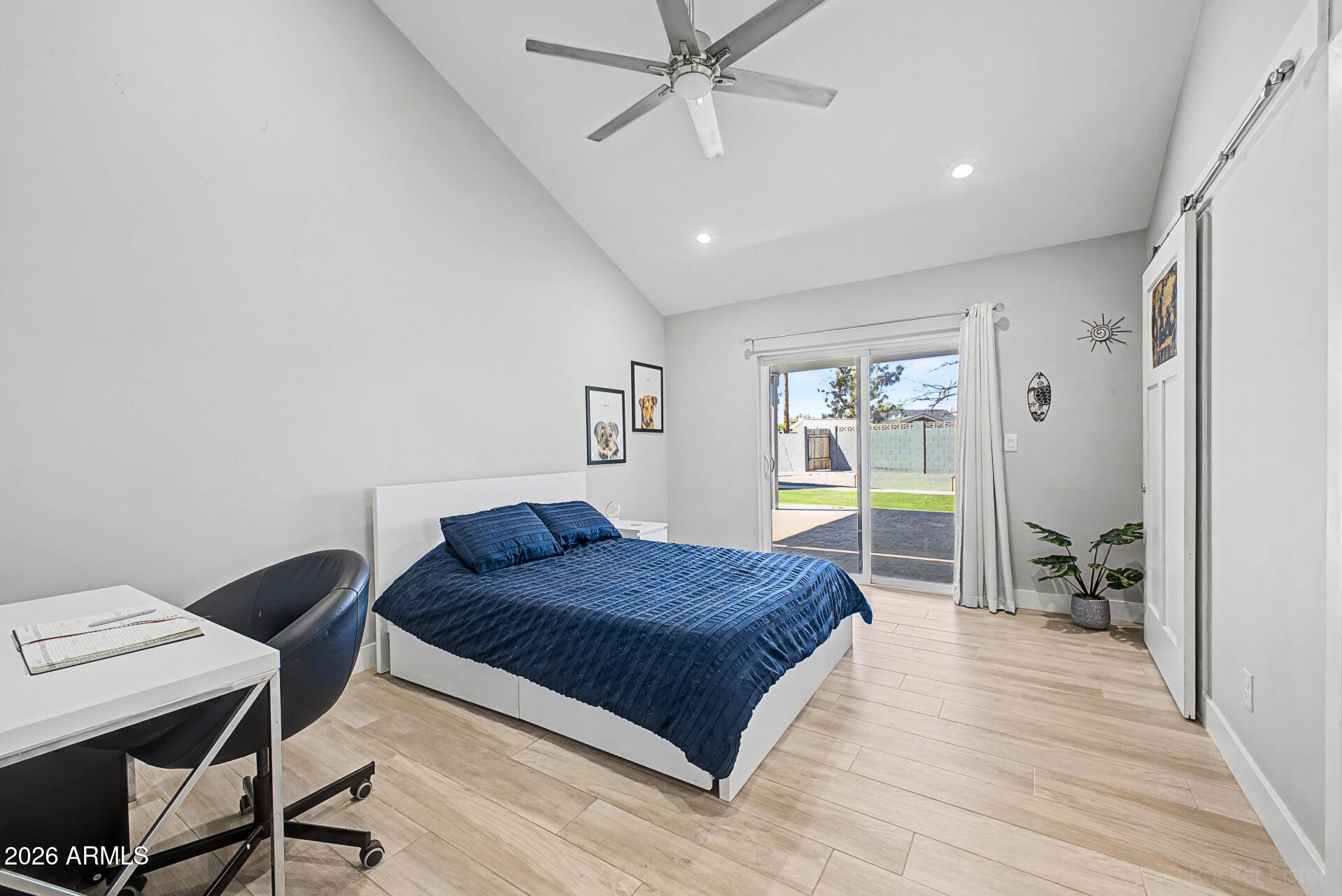 1930 East Rovey Avenue Phoenix, AZ 85016 - Photo 17 of 29 a spacious bedroom with a bed and a table in it