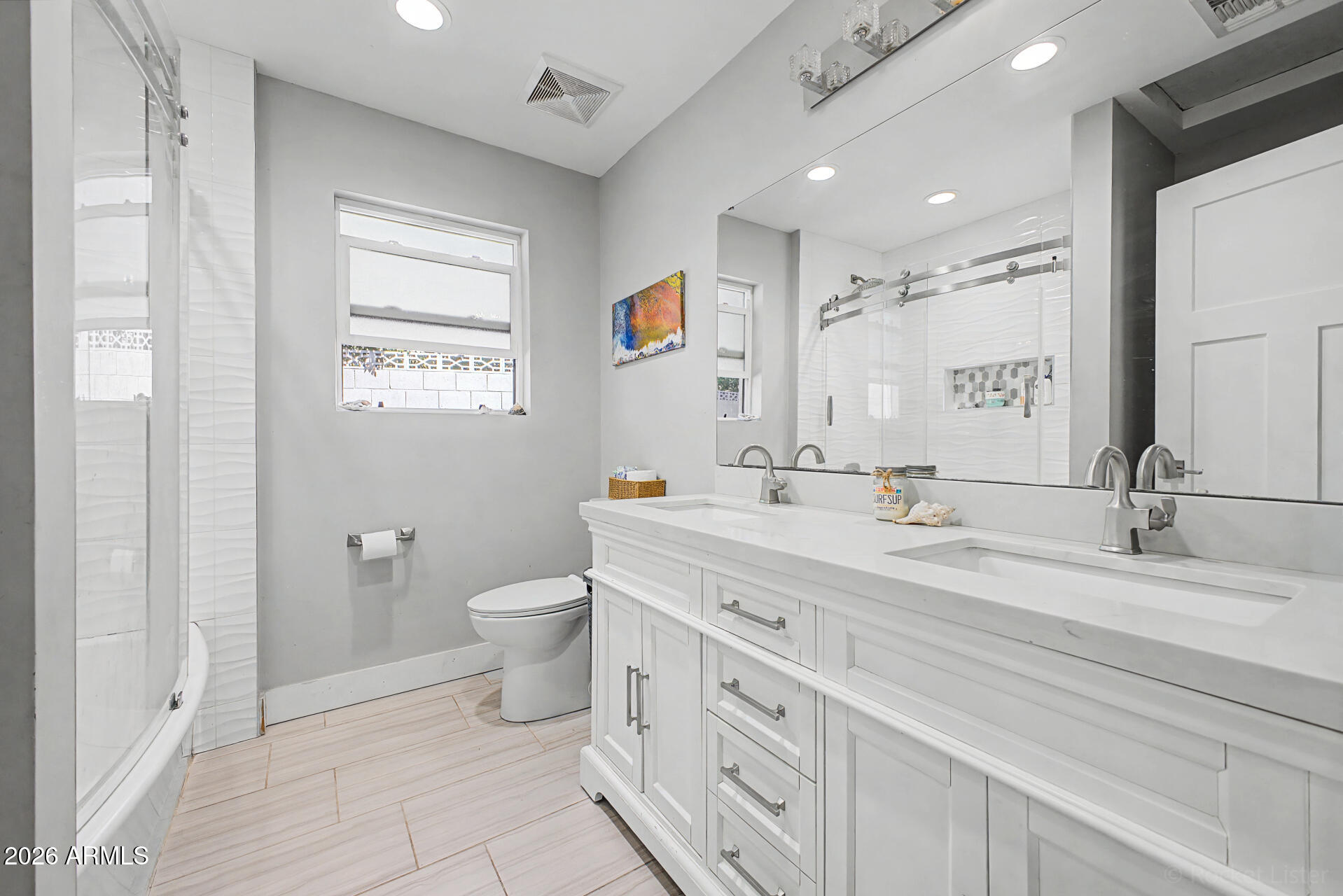 1930 East Rovey Avenue Phoenix, AZ 85016 - Photo 18 of 29 a bathroom with a double vanity sink toilet and a mirror