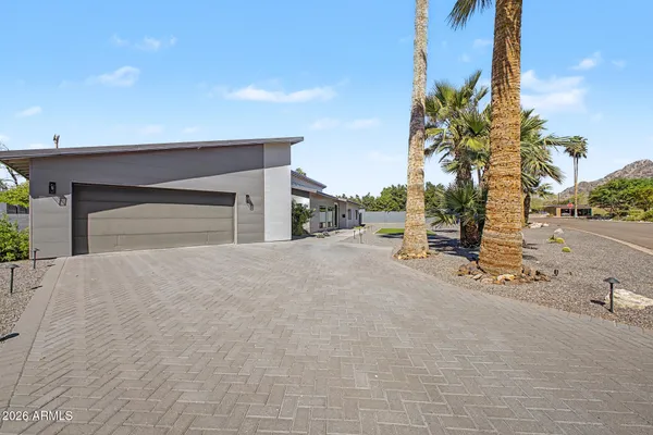 a view of a backyard with swimming pool