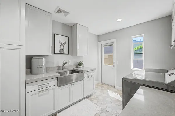 a backyard of a house with outdoor seating