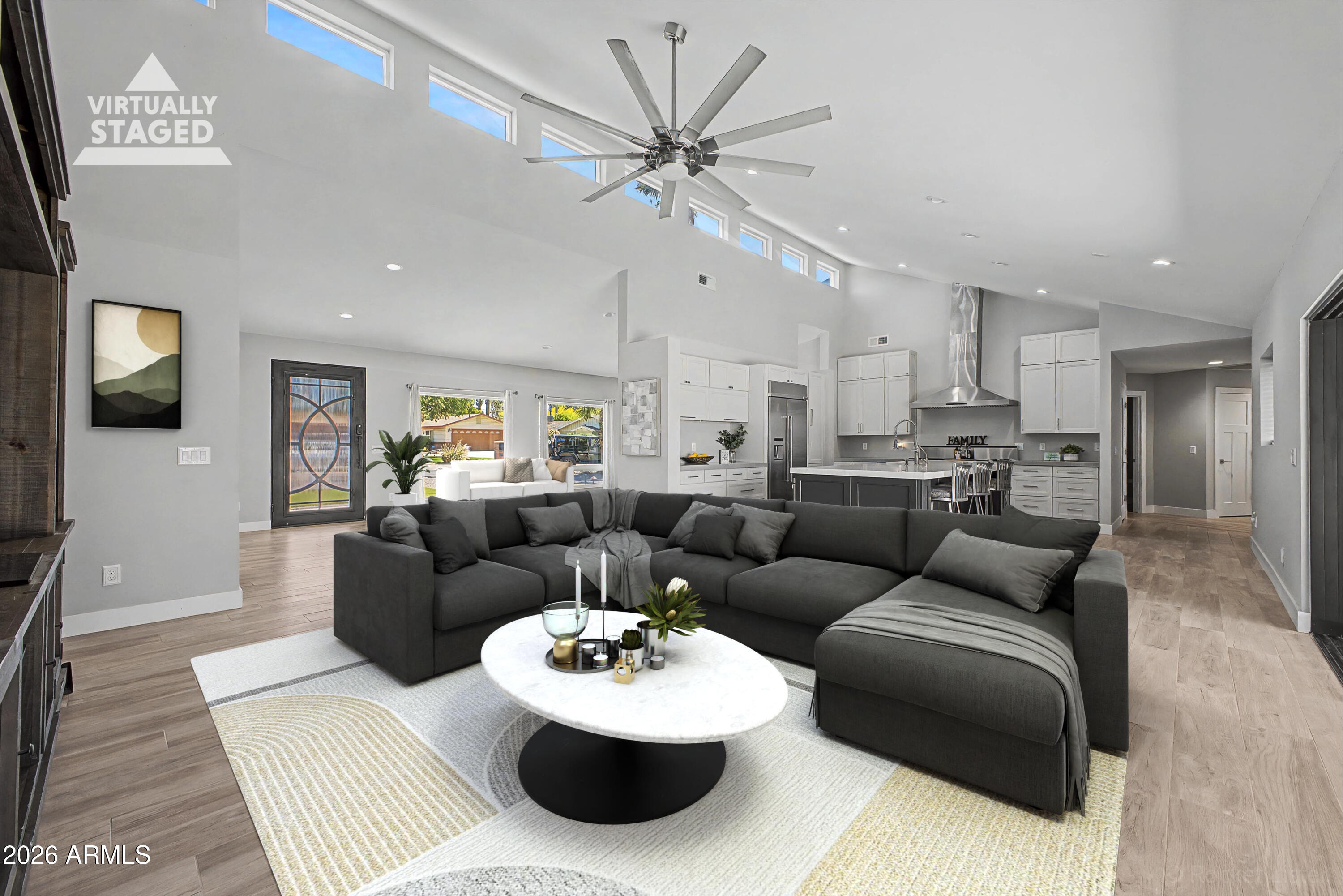1930 East Rovey Avenue Phoenix, AZ 85016 - Photo 5 of 29 a living room with furniture kitchen view and a chandelier