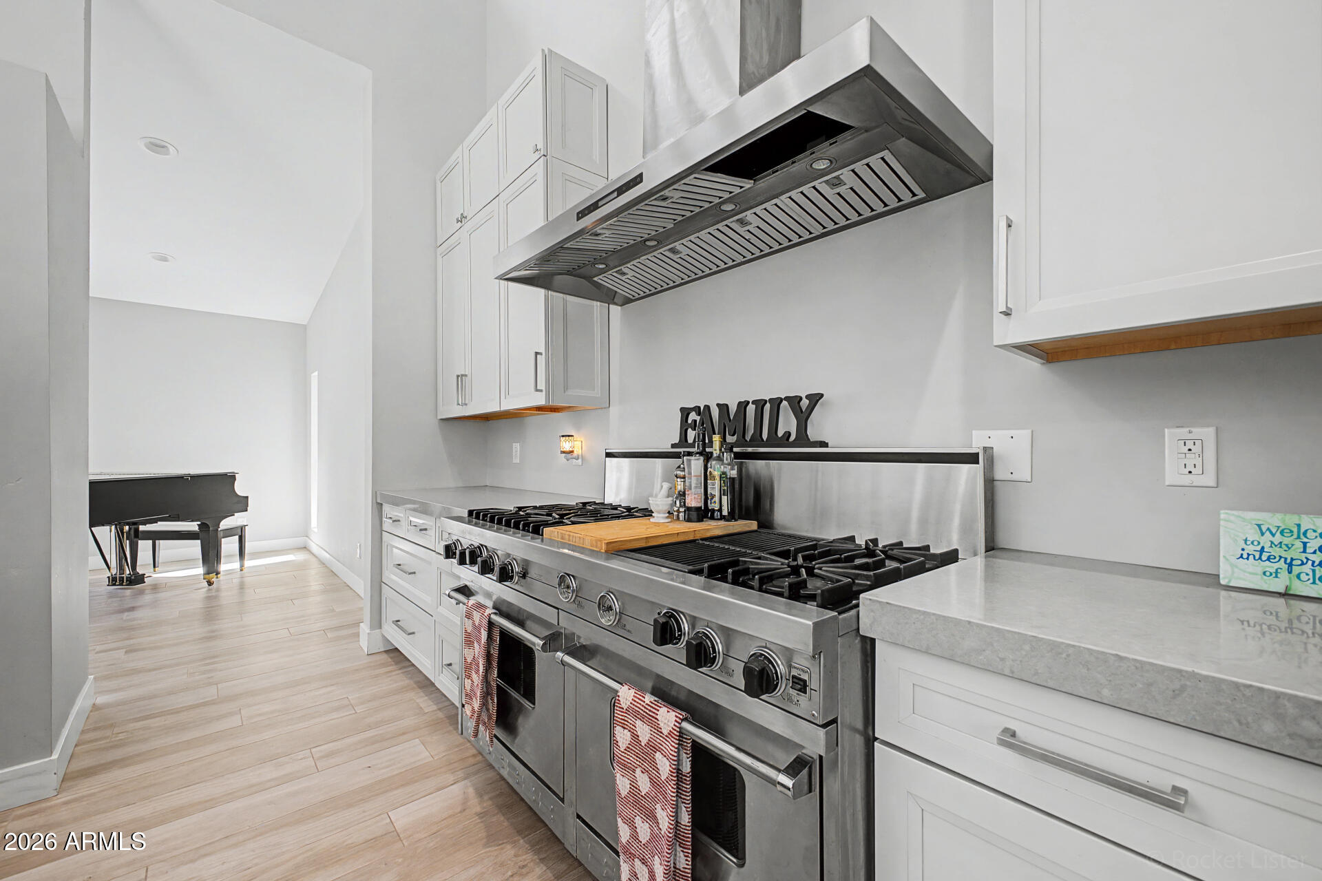 1930 East Rovey Avenue Phoenix, AZ 85016 - Photo 10 of 29 a kitchen with stainless steel appliances granite countertop a stove and a cabinets