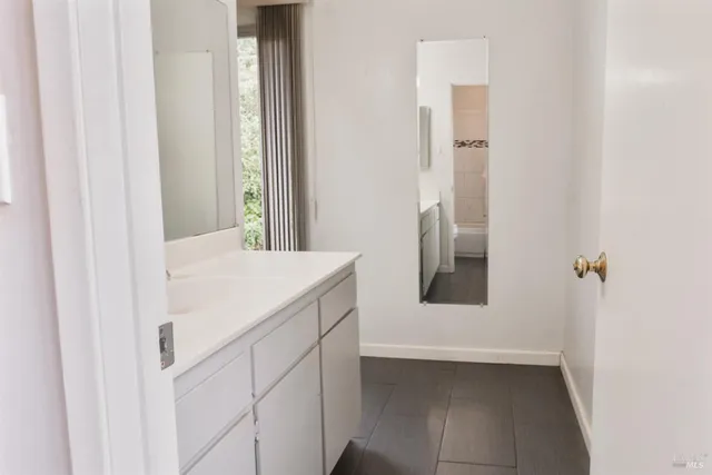 a bathroom with a sink and mirror