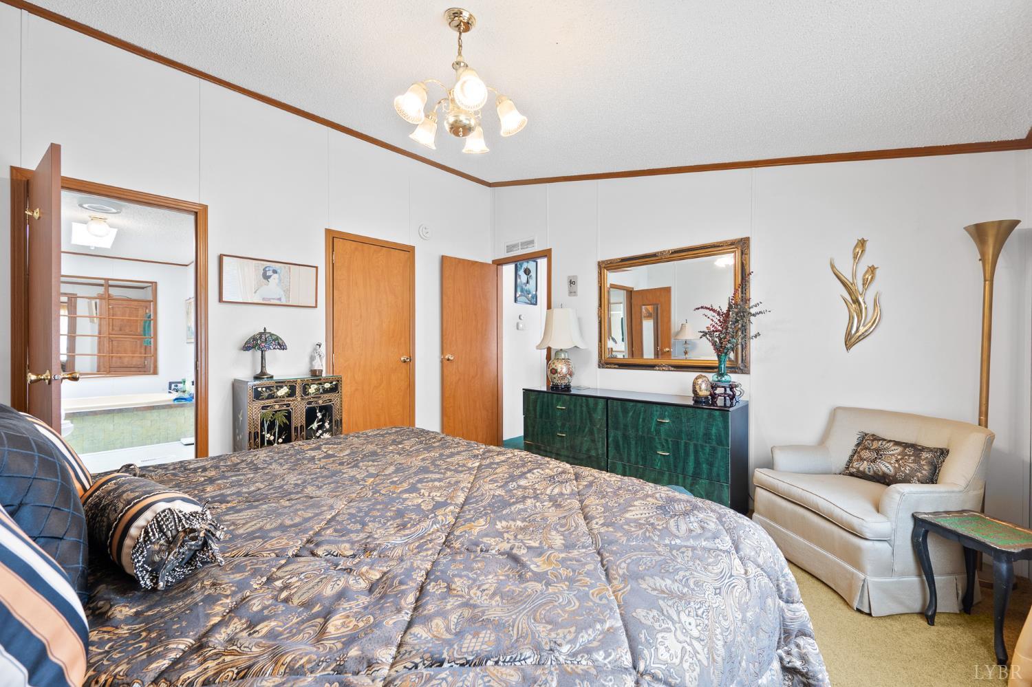 4400 Murray Hollow Road Thaxton, VA 24174 - Photo 42 of 56 a bedroom with a large bed and a dresser