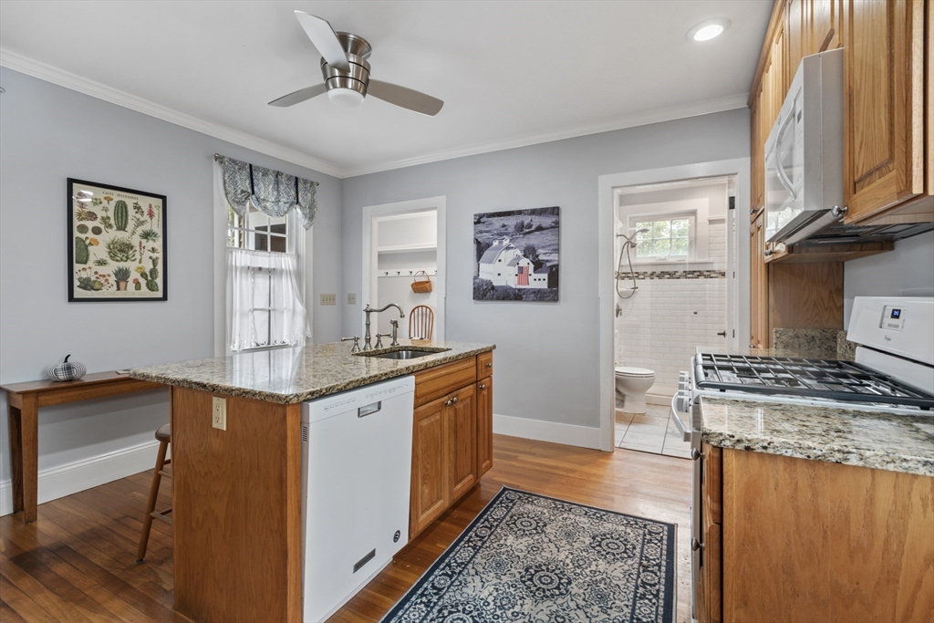 26 Maple Street Taunton, MA 02780 - Photo 11 of 31 a kitchen with stainless steel appliances granite countertop a sink stove and refrigerator