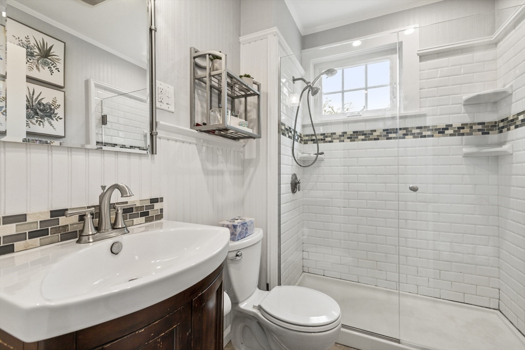 26 Maple Street Taunton, MA 02780 - Photo 13 of 31 a bathroom with a sink a toilet and shower