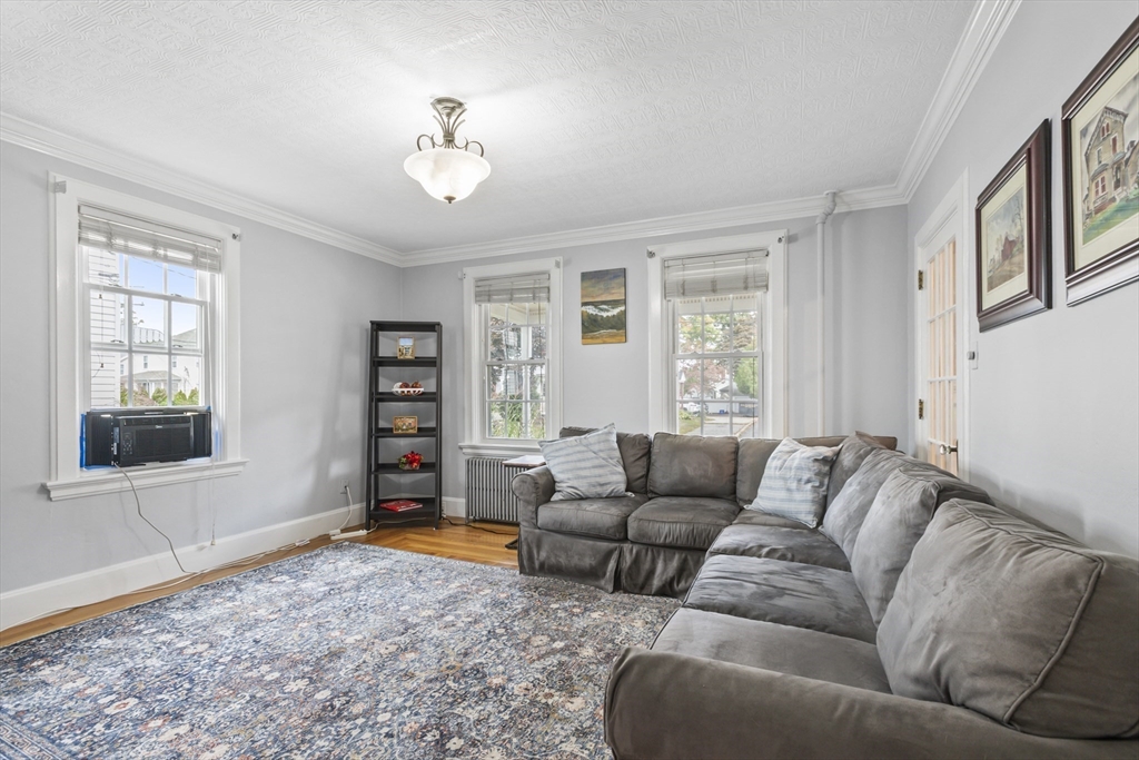 26 Maple Street Taunton, MA 02780 - Photo 18 of 31 a living room with furniture and a window