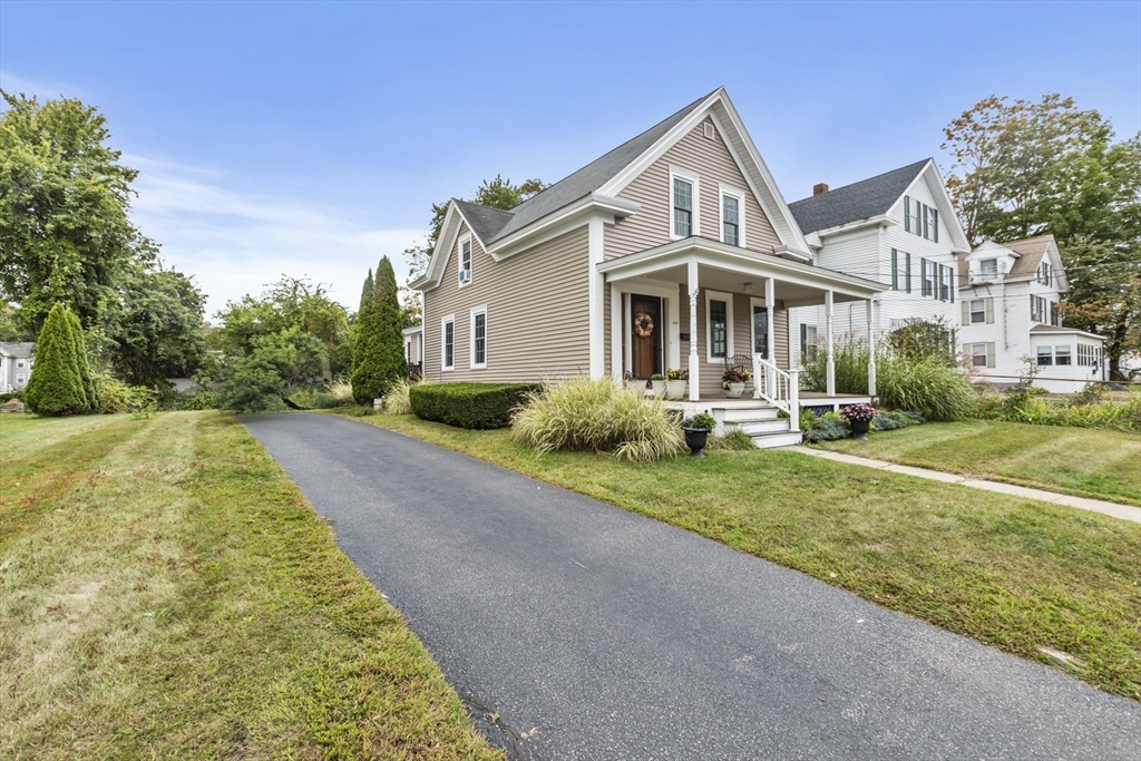 26 Maple Street Taunton, MA 02780 - Photo 2 of 31 a front view of a house with a yard
