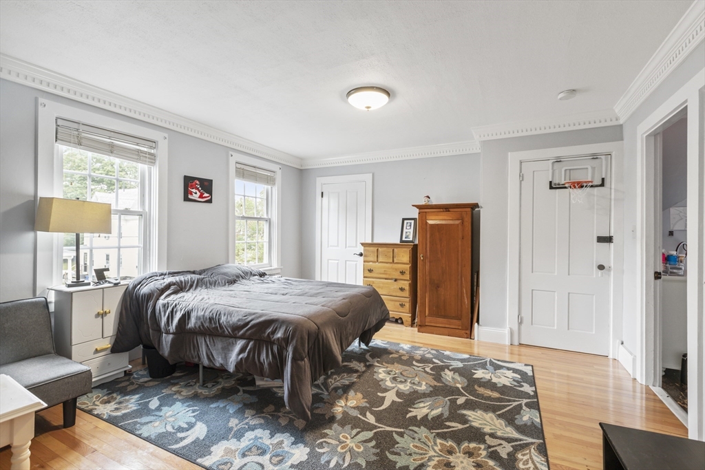 26 Maple Street Taunton, MA 02780 - Photo 23 of 31 a bedroom with a bed dresser and a window