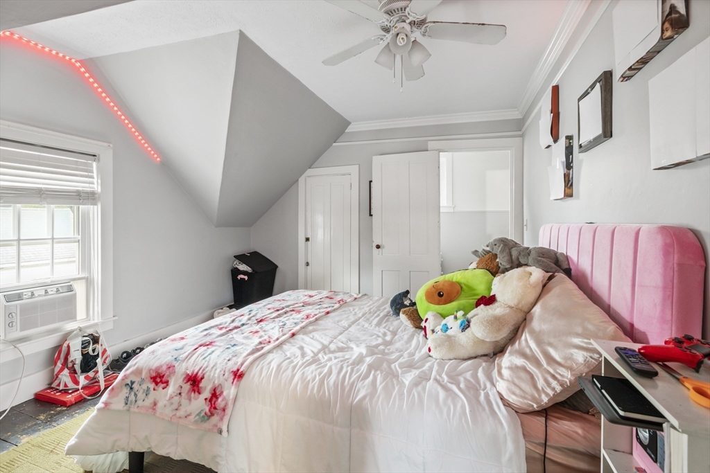 26 Maple Street Taunton, MA 02780 - Photo 24 of 31 a bedroom with a bed and a window