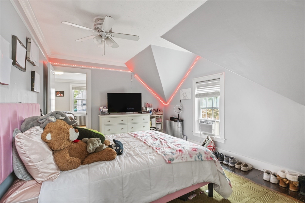 26 Maple Street Taunton, MA 02780 - Photo 25 of 31 a bedroom with a bed and a flat screen tv