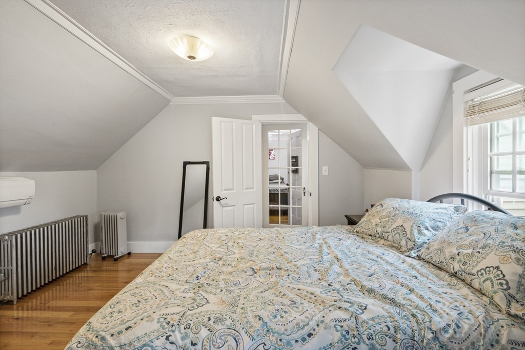 26 Maple Street Taunton, MA 02780 - Photo 27 of 31 a bedroom with a large bed and a window