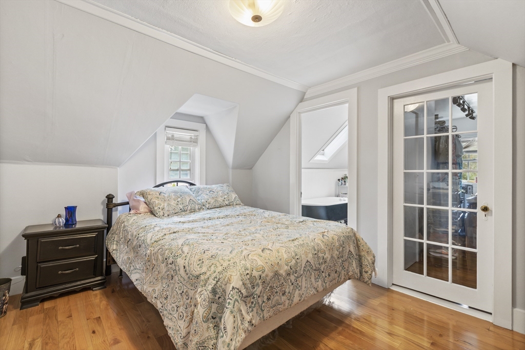 26 Maple Street Taunton, MA 02780 - Photo 28 of 31 a bedroom with a bed and a window