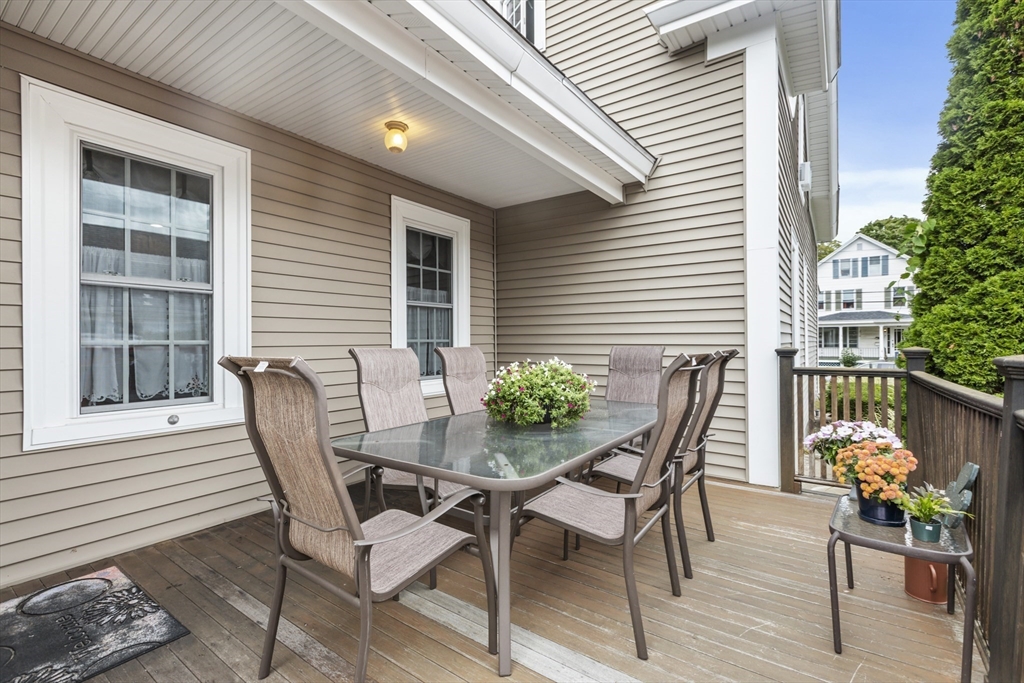 26 Maple Street Taunton, MA 02780 - Photo 4 of 31 a view of a two chairs and table in the patio