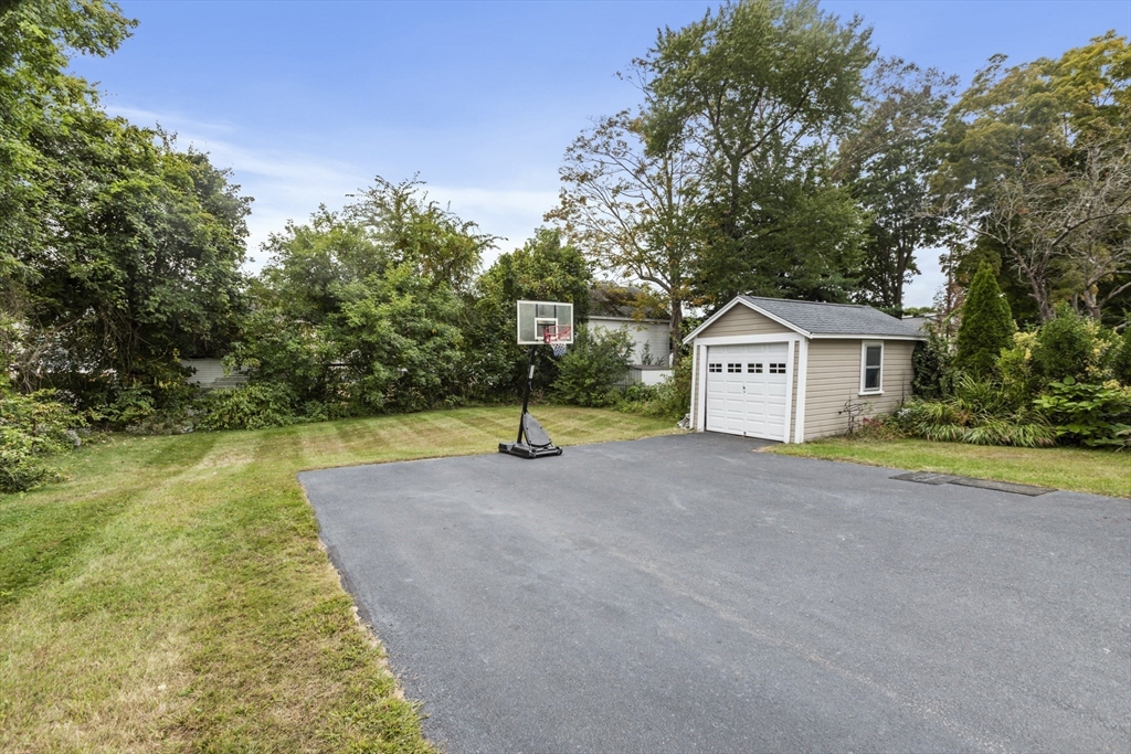 26 Maple Street Taunton, MA 02780 - Photo 6 of 31 a house with swimming pool in front of it