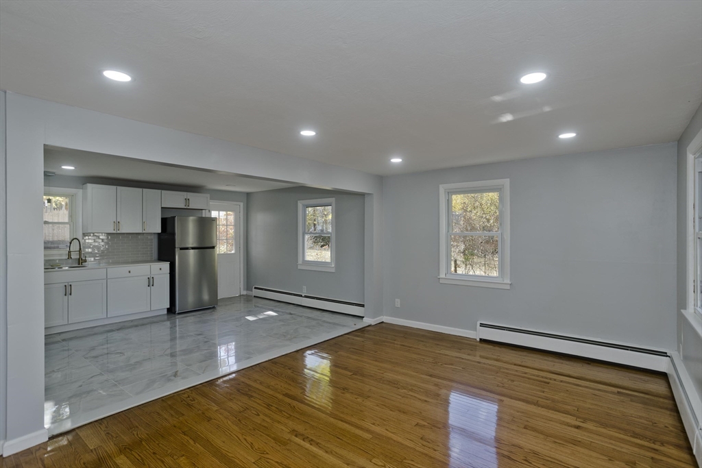 37 Wilber Street Springfield, MA 01104 - Photo 9 of 27 a view of empty room with wooden floor and fan