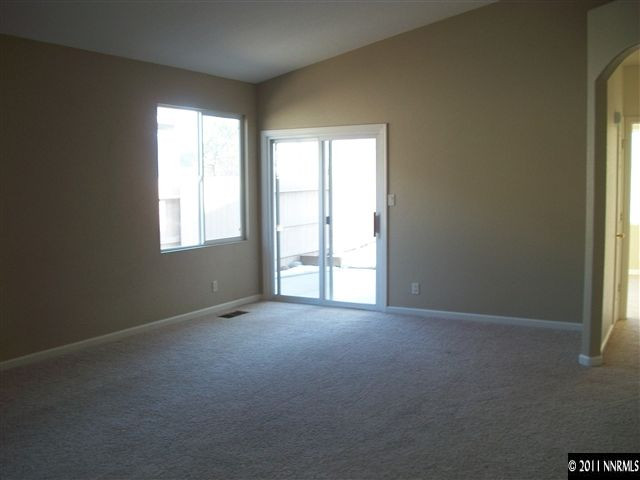 10055 Stonefield Drive Reno, NV 89521 - Photo 3 of 7 an empty room with windows