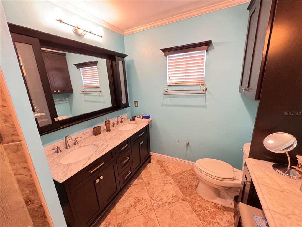 6286 Southwest 110th Street Ocala, FL 34476 - Photo 8 of 14 a bathroom with a sink vanity mirror and toilet