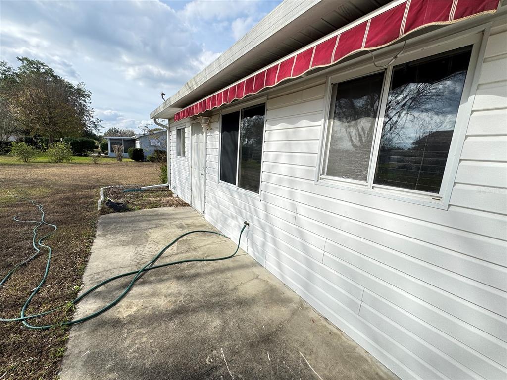 6286 Southwest 110th Street Ocala, FL 34476 - Photo 9 of 14 a view of a house with a patio