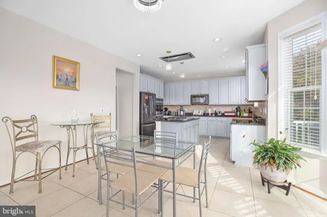 a living room with fireplace furniture and a flat screen tv
