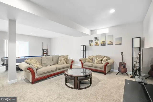 a workspace with furniture and a flat screen tv