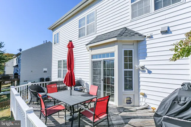 a backyard of a house with outdoor seating