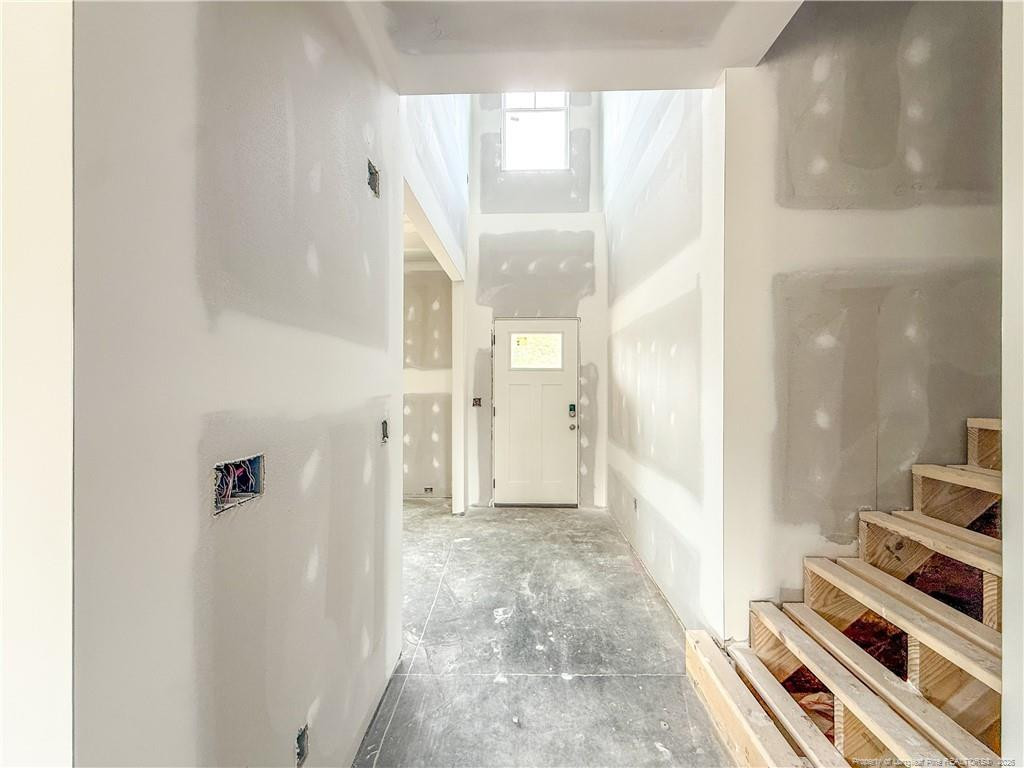 3318 S River Wade, NC 28395 - Photo 2 of 22 a view of a hallway with wooden floor and staircase