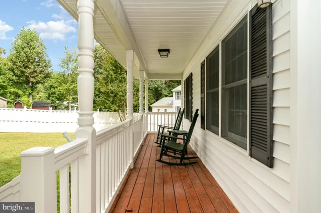 a view of a balcony with chairs