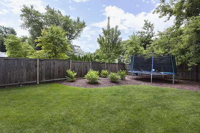 2705 Cherry Lane Northbrook, IL 60062 - Photo 24 of 25 a view of a backyard with table and chairs and wooden fence