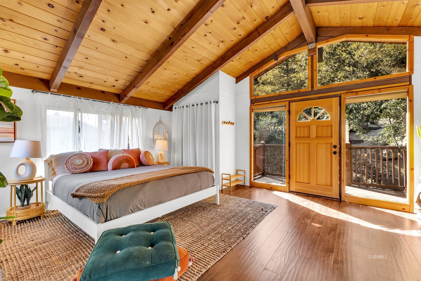 26870 Robin Drive Idyllwild, CA 92549 - Photo 15 of 68 a bedroom with a bed and wooden floor