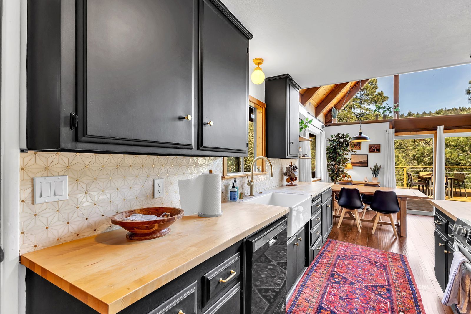 26870 Robin Drive Idyllwild, CA 92549 - Photo 35 of 68 a kitchen with a stove and a sink